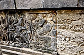 Prambanan - Ramayana reliefs of Shiva Temple. A scene (possibly from the Mahabharata and inserted into the Ramayana relief): Rama shoots a crocodile who is transformed into a celestial nymph.  